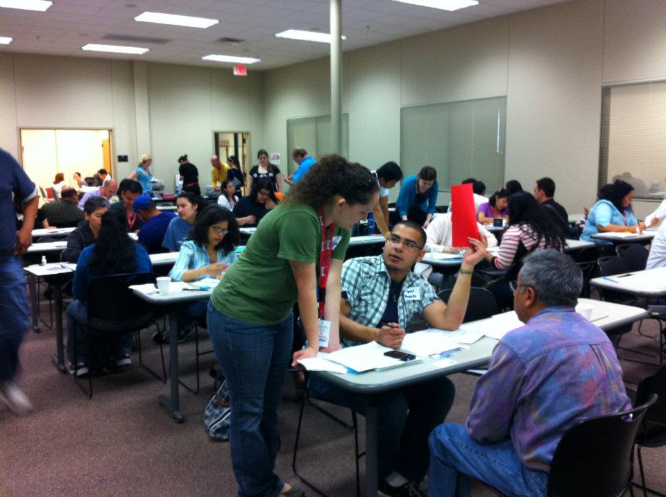 Zócalo volunteers assisting with an immigrant naturalization workshop